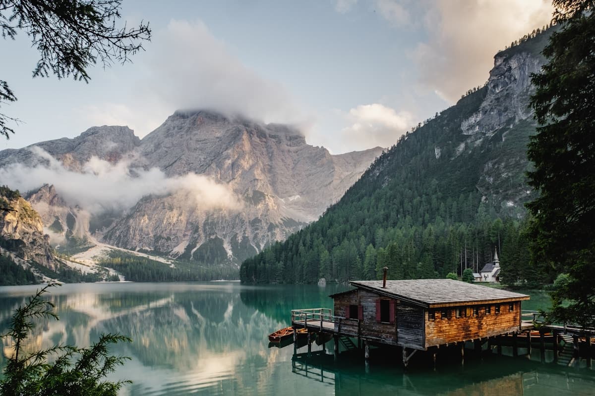 A quiet lake surrounded by dark hills